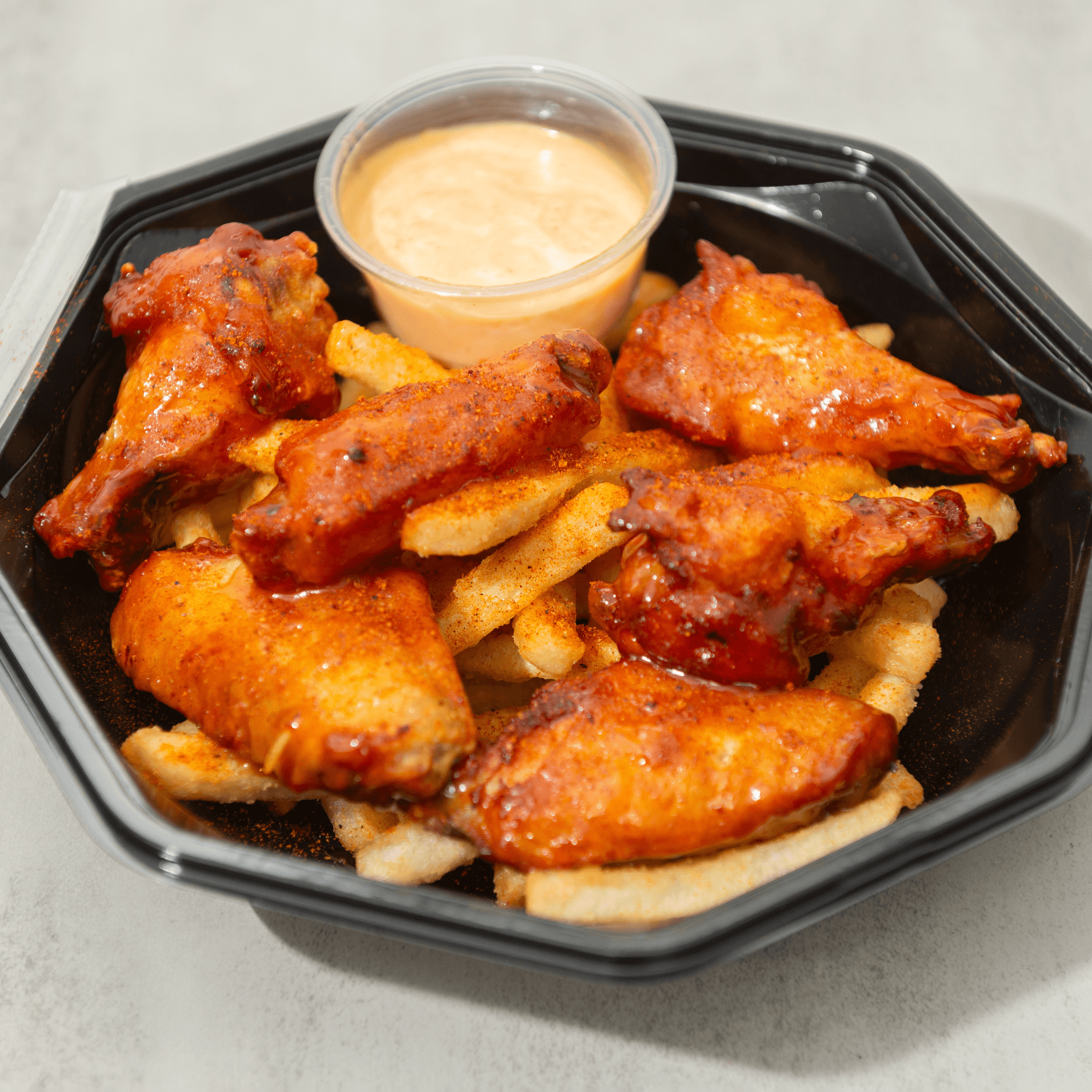Buffalo Wings Over Seasoned Crispy Fries.